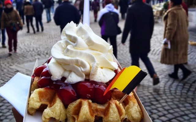 photo of waffles with cherries and cream