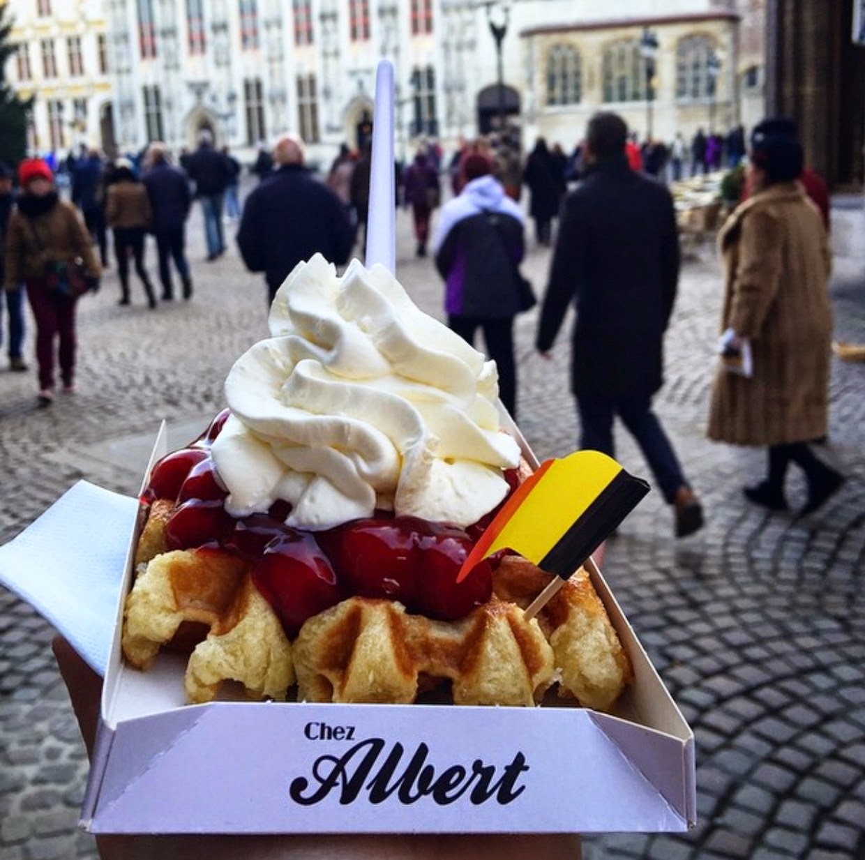 photo of waffles with cherries and cream